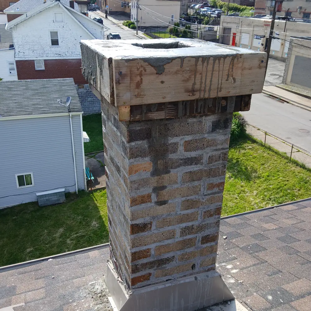 During: a wooden form built around the top of the same chimney for the new crown
